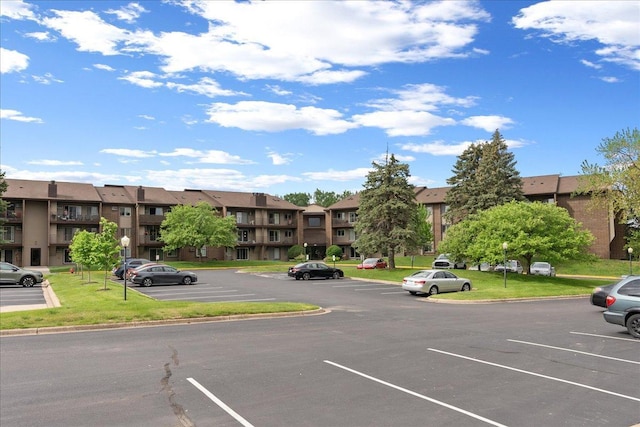 3440 Golfview Dr Unit 123, Eagan, MN 55123 - view of property featuring uncovered parking and a residential view