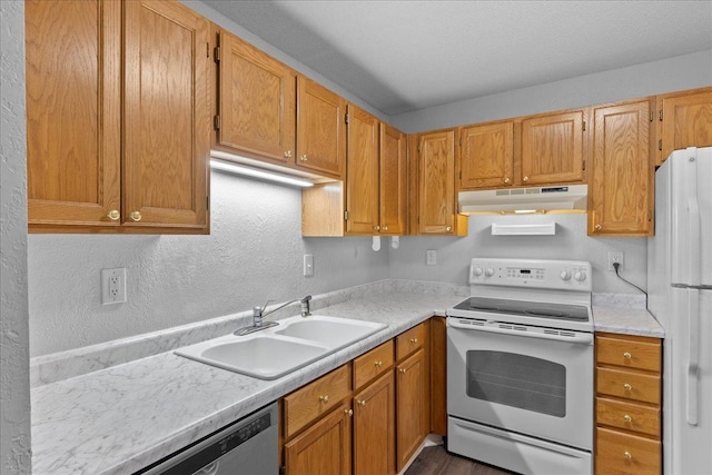 3440 Golfview Dr Unit 123, Eagan, MN 55123 - kitchen with white appliances, a sink, under cabinet range hood, light countertops, and a textured wall