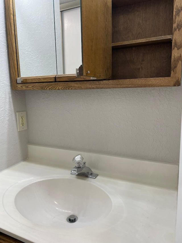 3440 Golfview Dr Unit 123, Eagan, MN 55123 - bathroom featuring vanity and a textured wall