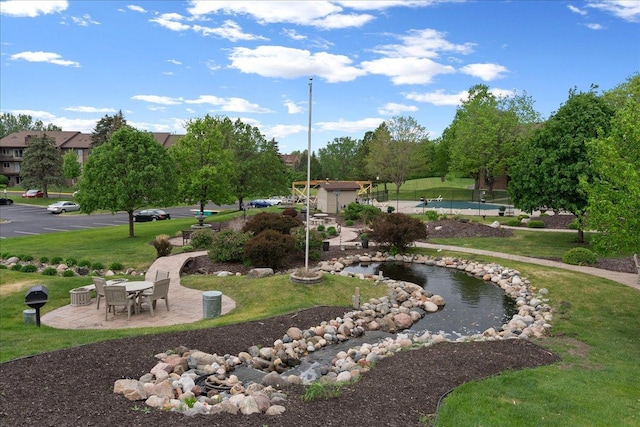 3440 Golfview Dr Unit 123, Eagan, MN 55123 - surrounding community featuring a patio area and a lawn