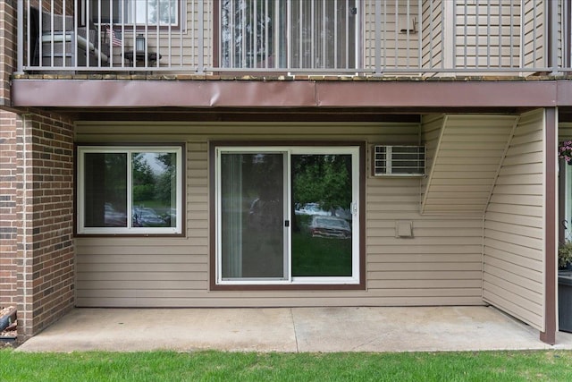3440 Golfview Dr Unit 123, Eagan, MN 55123 - back of house with a balcony, brick siding, and a patio area