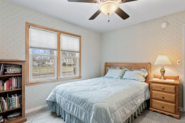 carpeted bedroom featuring ceiling fan, baseboards, and wallpapered walls