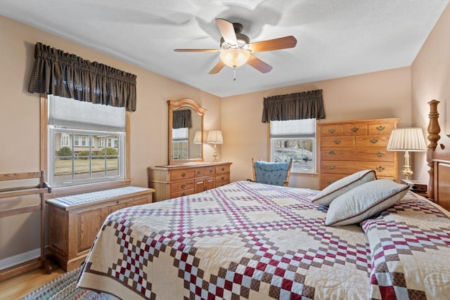 bedroom featuring light wood-style floors and a ceiling fan