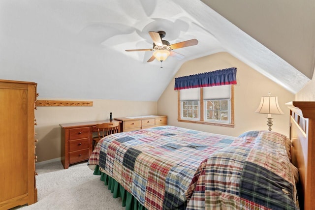 bedroom featuring light carpet, lofted ceiling, ceiling fan, and baseboards