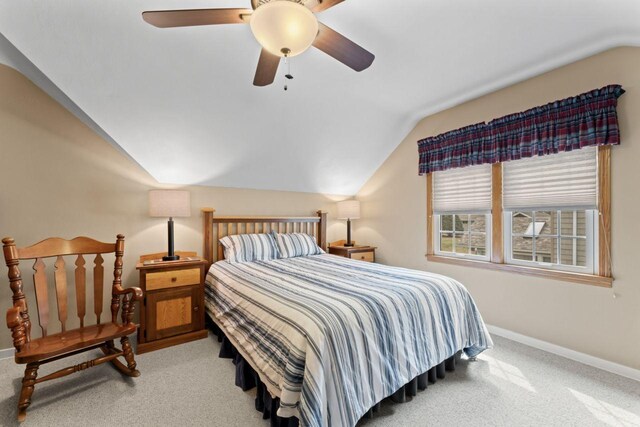 bedroom with lofted ceiling, baseboards, carpet, and a ceiling fan