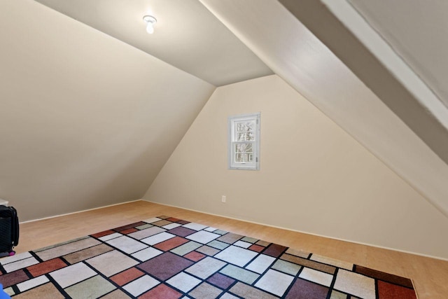 bonus room featuring lofted ceiling