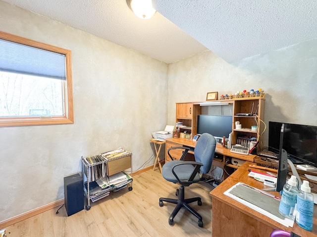 49262 Big Pine Rd, Perham, MN 56573 - office space featuring wood finished floors, a textured ceiling, baseboards, and a textured wall
