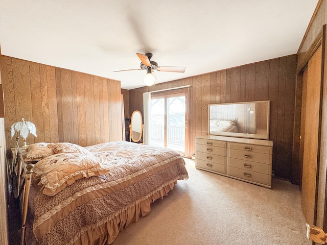 49262 Big Pine Rd, Perham, MN 56573 - bedroom with access to outside, wood walls, light colored carpet, and ceiling fan