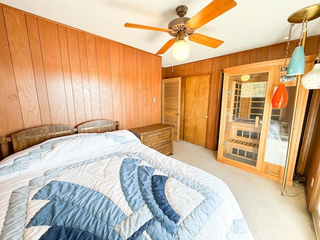 49262 Big Pine Rd, Perham, MN 56573 - bedroom featuring wooden walls, carpet flooring, and a ceiling fan