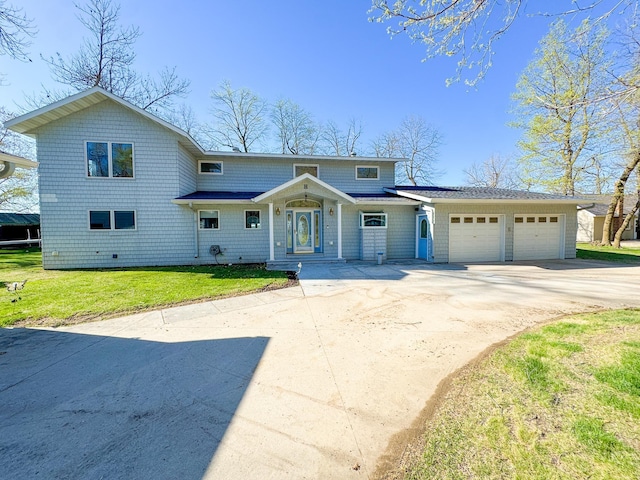 49262 Big Pine Rd, Perham, MN 56573 - view of front facade with concrete driveway, an attached garage, and a front lawn