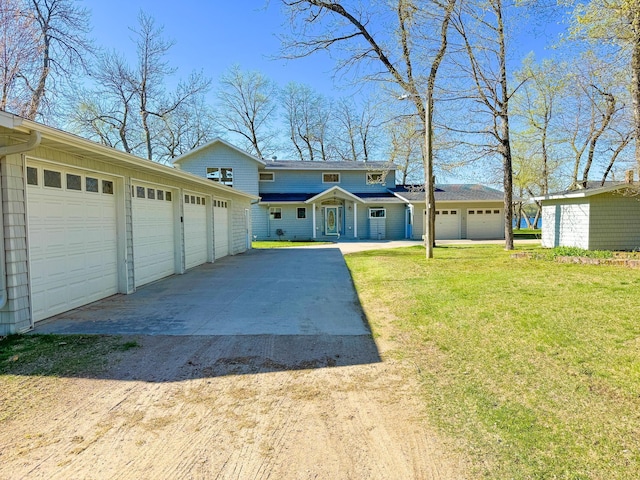 49262 Big Pine Rd, Perham, MN 56573 - view of front facade with dirt driveway, a front lawn, and a garage