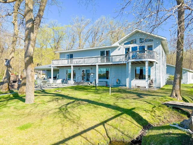49262 Big Pine Rd, Perham, MN 56573 - rear view of house featuring a yard, a patio, and a deck