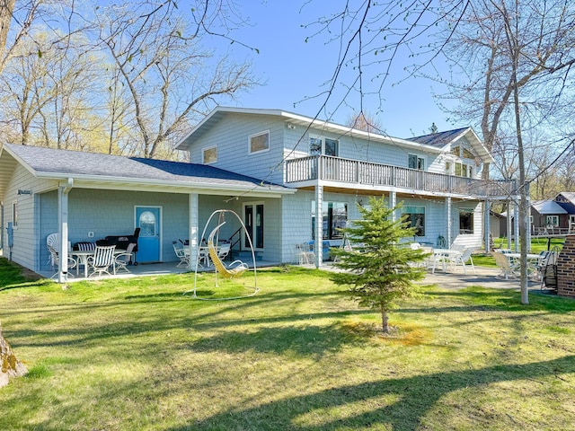 49262 Big Pine Rd, Perham, MN 56573 - rear view of property featuring a patio, a yard, and a balcony