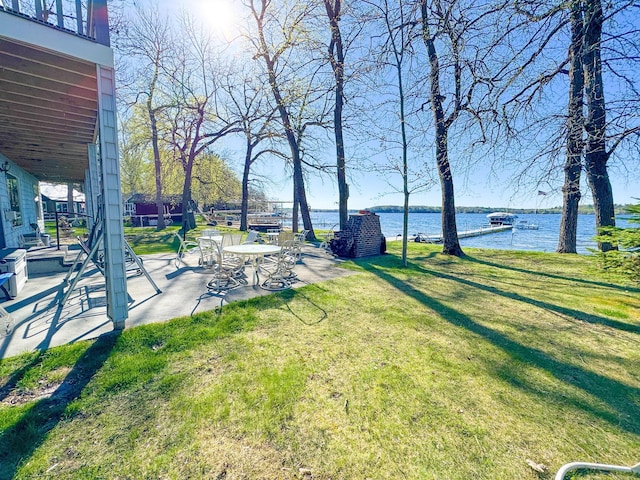 49262 Big Pine Rd, Perham, MN 56573 - view of green lawn with a water view and a patio