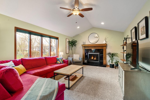 carpeted living area featuring a tile fireplace, ceiling fan, vaulted ceiling, and recessed lighting
