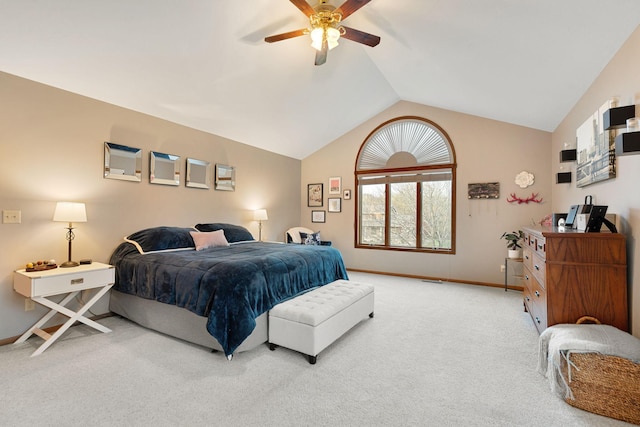 carpeted bedroom featuring lofted ceiling, baseboards, and ceiling fan