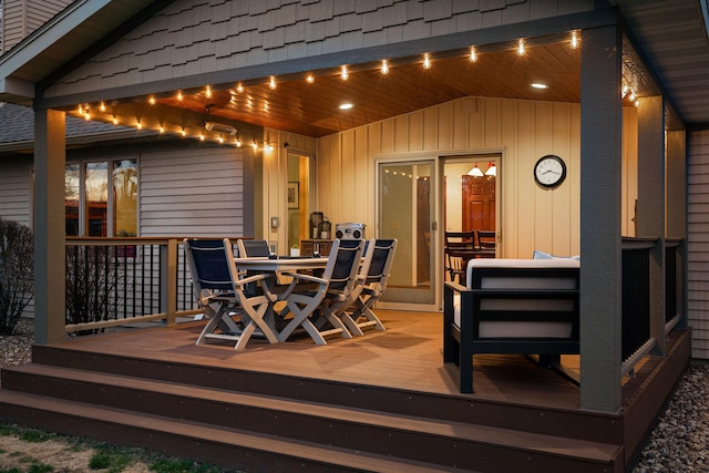 wooden deck with outdoor dining space