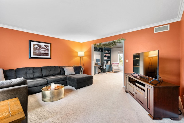 living area with ornamental molding, an office area, and light colored carpet