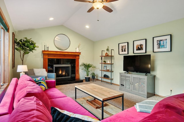 living room featuring a ceiling fan, a tile fireplace, vaulted ceiling, carpet floors, and recessed lighting