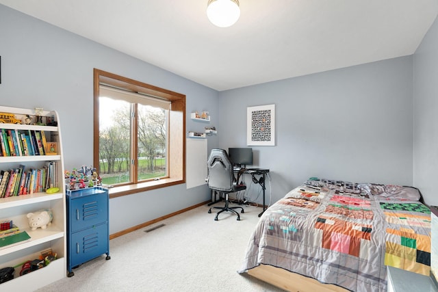 carpeted bedroom with baseboards