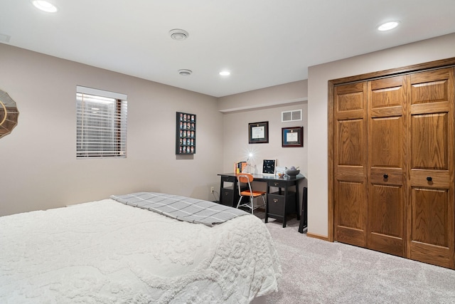 carpeted bedroom with recessed lighting