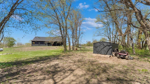12911 Turtle Lake Ct SW, Lake Mary Twp, MN 56308 - view of green lawn featuring an outdoor structure and a storage shed