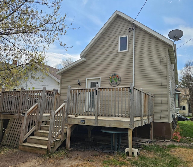 back of property featuring a deck