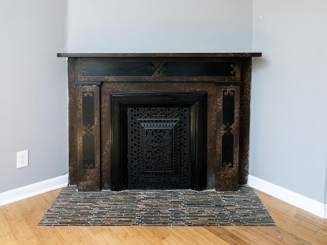 detailed view of baseboards and wood finished floors