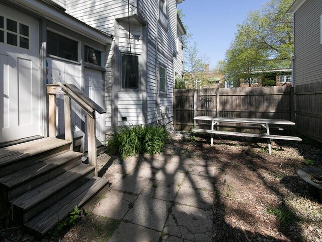 view of patio / terrace featuring fence