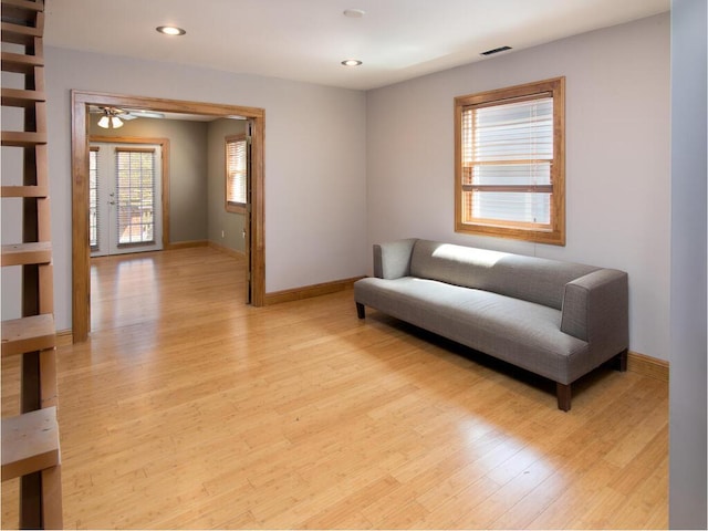 sitting room with light wood-style floors, baseboards, recessed lighting, and a ceiling fan