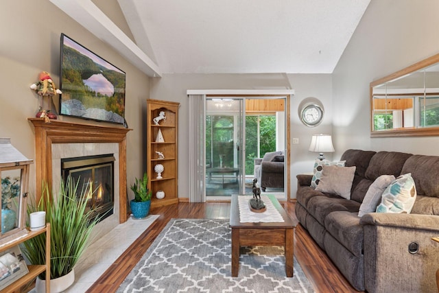 5662 Donegal Dr, Shoreview, MN 55126 - living room with lofted ceiling, wood finished floors, and a tile fireplace