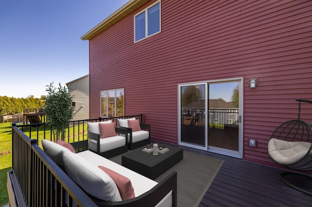 deck featuring an outdoor living space and a lawn