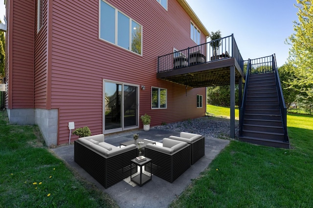 back of property with stairway, outdoor lounge area, a yard, a deck, and a patio