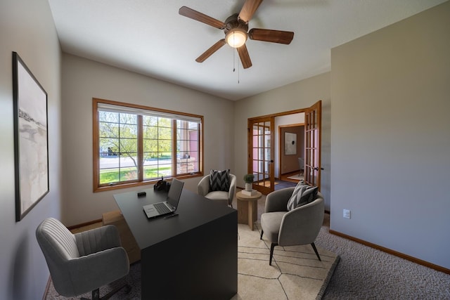 home office featuring a ceiling fan, light colored carpet, baseboards, and french doors