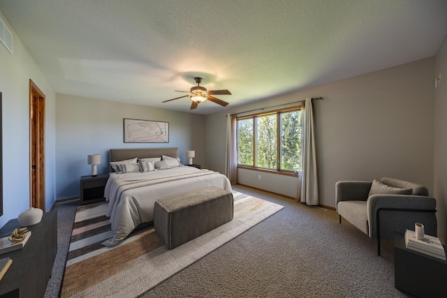 bedroom with light colored carpet, a ceiling fan, and baseboards
