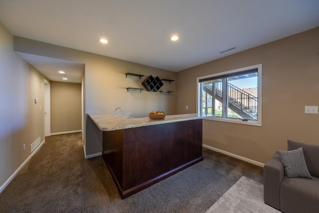 indoor wet bar with dark carpet, baseboards, and recessed lighting