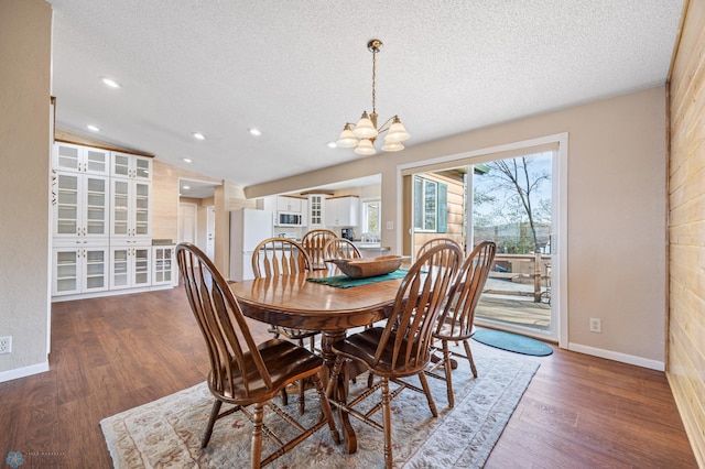 24295 Matson Point Trl, Lida Twp, MN 56572 - dining room featuring a textured ceiling, a chandelier, wood finished floors, baseboards, and recessed lighting