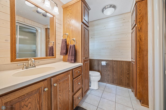 24295 Matson Point Trl, Lida Twp, MN 56572 - bathroom featuring wood walls, toilet, vanity, tile patterned flooring, and a textured ceiling