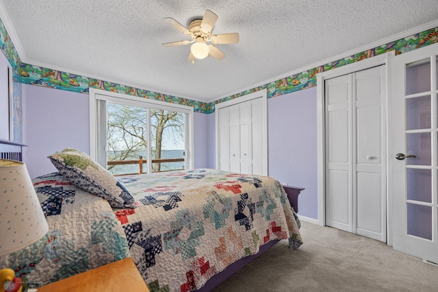 24295 Matson Point Trl, Lida Twp, MN 56572 - bedroom featuring multiple closets, carpet flooring, a textured ceiling, and ceiling fan