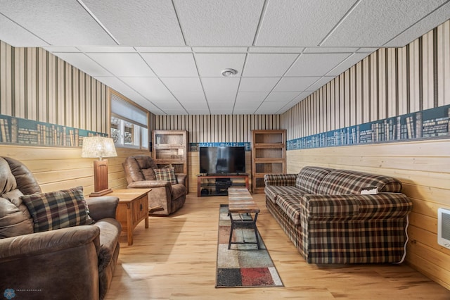 24295 Matson Point Trl, Lida Twp, MN 56572 - living room with wallpapered walls, light wood-style floors, and wood walls