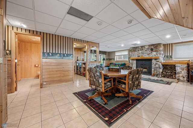 24295 Matson Point Trl, Lida Twp, MN 56572 - tiled dining space with wood walls and a drop ceiling