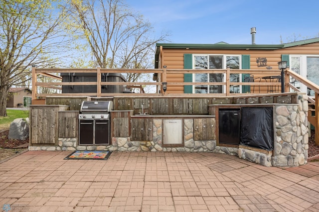 24295 Matson Point Trl, Lida Twp, MN 56572 - view of patio / terrace with an outdoor kitchen and grilling area