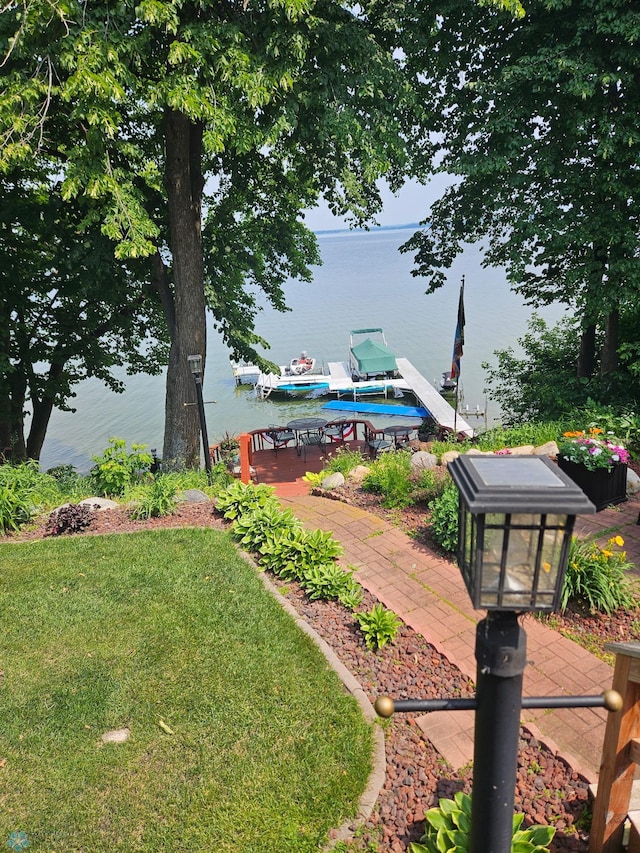 24295 Matson Point Trl, Lida Twp, MN 56572 - view of grassy yard featuring a water view and a boat dock