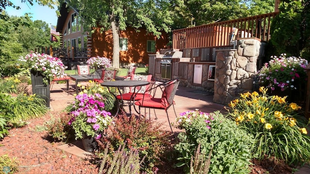 24295 Matson Point Trl, Lida Twp, MN 56572 - view of patio / terrace with a wooden deck and outdoor dining area