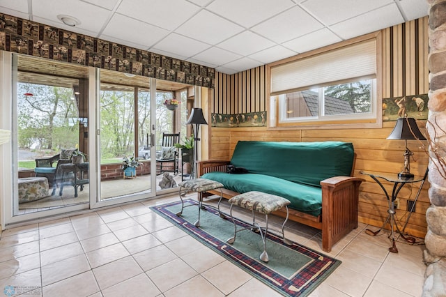 24295 Matson Point Trl, Lida Twp, MN 56572 - living area with light tile patterned floors, a paneled ceiling, and wood walls
