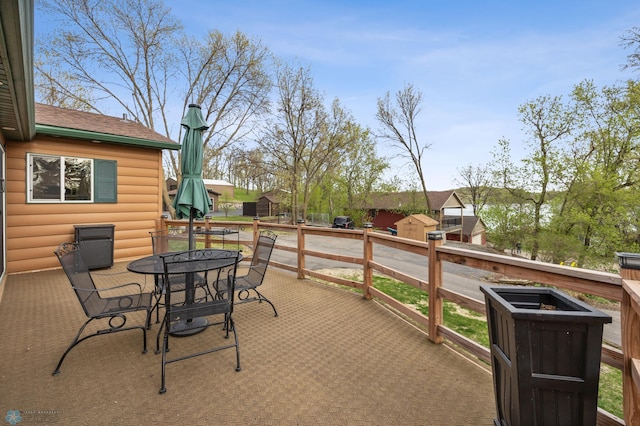 24295 Matson Point Trl, Lida Twp, MN 56572 - view of patio / terrace featuring outdoor dining area and a wooden deck