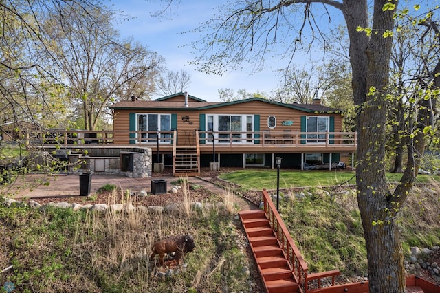 24295 Matson Point Trl, Lida Twp, MN 56572 - back of house featuring stairway, log veneer siding, a deck, and a lawn