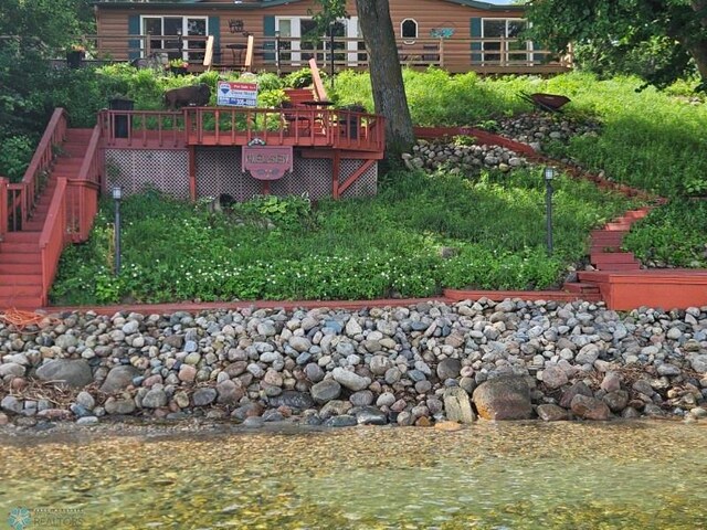 24295 Matson Point Trl, Lida Twp, MN 56572 - view of yard with stairs and a wooden deck