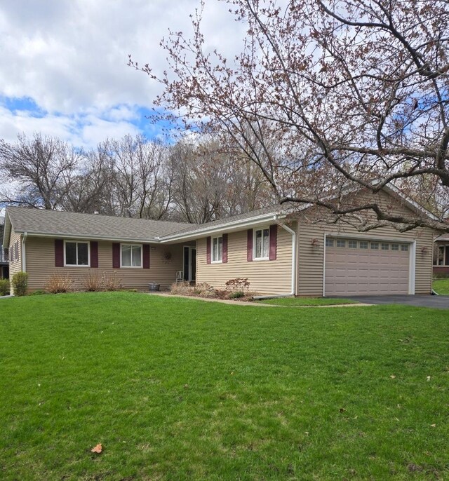 14140 Vale Ct, Eden Prairie, MN 55346 - ranch-style home featuring an attached garage, driveway, and a front lawn