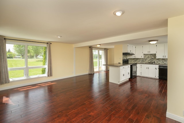 kitchen featuring range with electric cooktop, black dishwasher, open floor plan, under cabinet range hood, and dark countertops